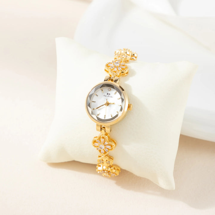 Elina – Goldene Uhr mit Blumenarmband.