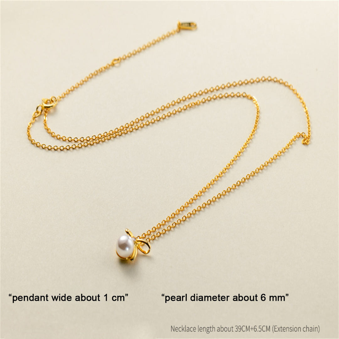 Johanna-Luisa – Goldene Ohrringe mit doppelter Perle.